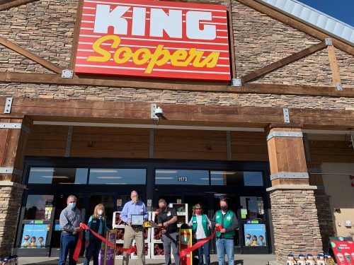 Ribbon Cutting Ceremony outside evergreen store